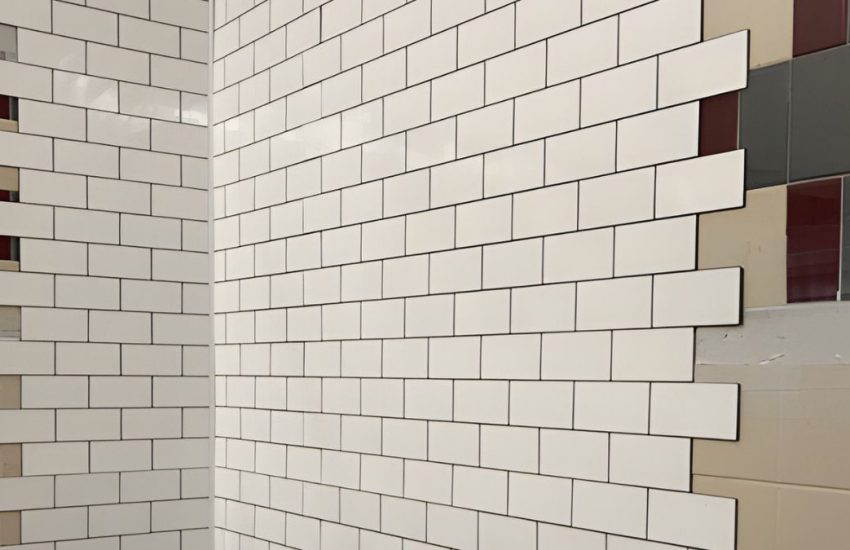 FRP tile sheets by Marlite installed over existing tile.