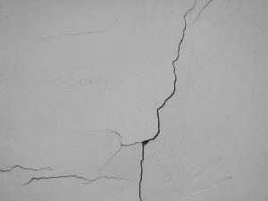 Control Joint vs Expansion Joint: How to Tell Them Apart 2 Cracks on the wall