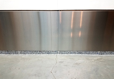 Stainless steel molding wall base protects baseboards and walls from damage