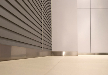 Stainless steel molding wall base protects baseboards and walls from damage
