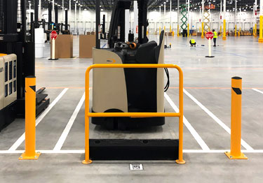 Steel bollard kit in high visibility yellow prevents damage from machinery