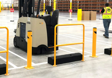 Steel bollard kit in high visibility yellow prevents damage from machinery