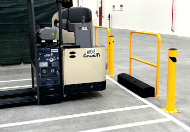 Steel bollard kit in high visibility yellow prevents damage from machinery