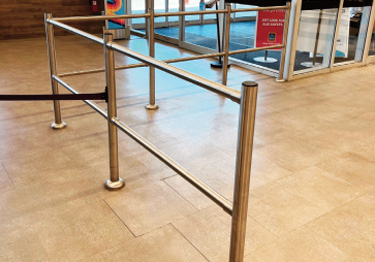 Modular rail system in brushed stainless steel guides customers in the store