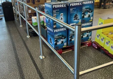 Modular rail system in brushed stainless steel guides customers in the store